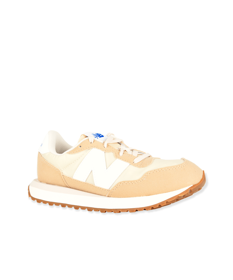 Tenis new balance store niño beige